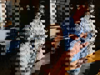 Two coworkes in conversation.