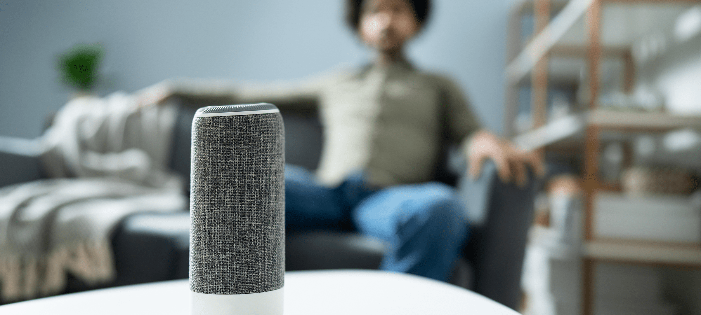 Man sitting with Voice Controlled Device