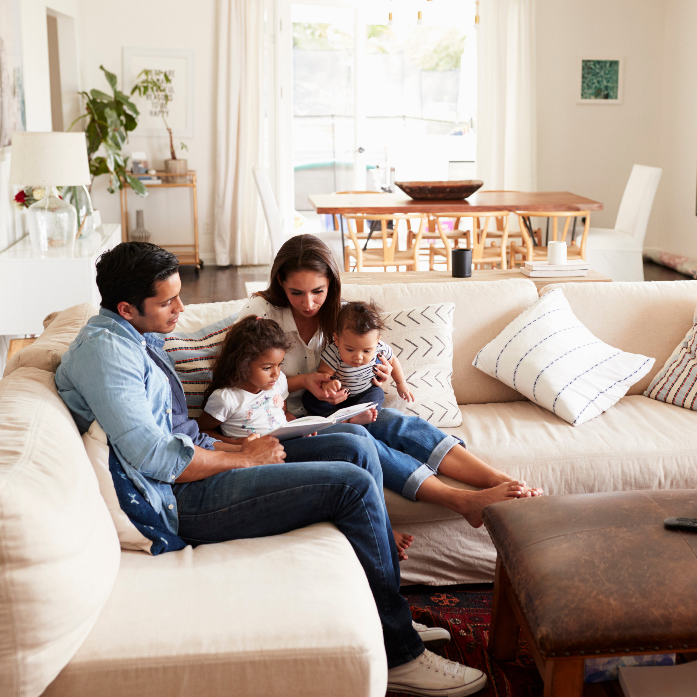 A family sitting on a couch